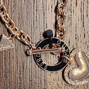 Gold Guess brand heart charm necklace
